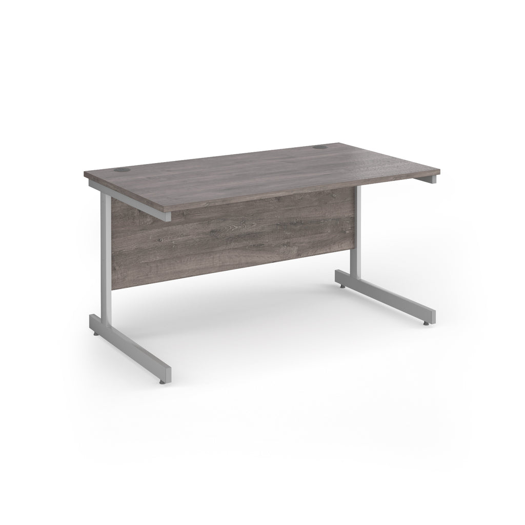 Rectangular desk with grey wood-effect top and silver metal frame on a white background
