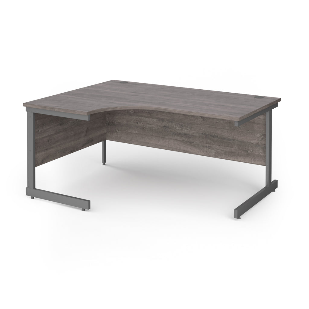 Corner desk with grey wood-effect top and grey metal frame on a white background