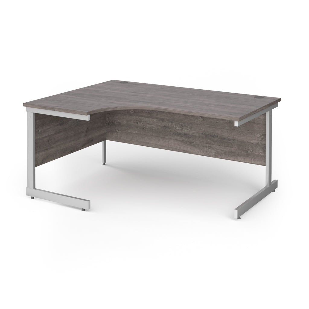 Corner desk with grey wood-effect top and white metal frame on a white background