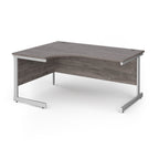 Corner desk with grey wood-effect top and white metal frame on a white background
