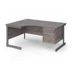 Corner office desk with a grey wood-grain finish and a dark grey metal frame, featuring two drawers on the right side.