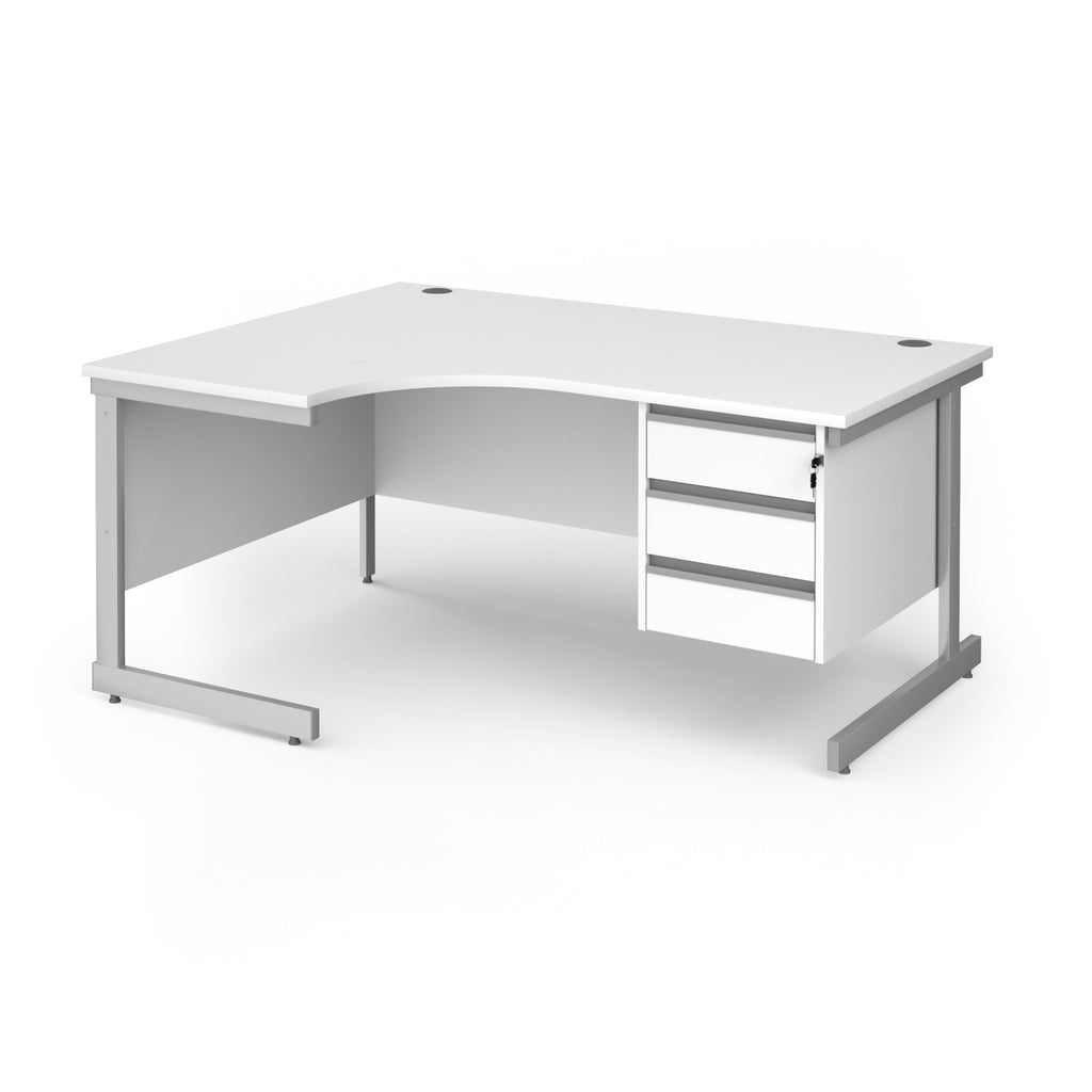 A white corner office desk with a three-drawer pedestal on the right and a silver metal frame, shown on a solid white background.