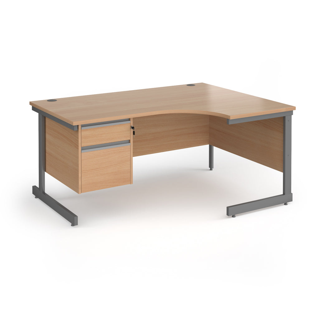 Corner office desk with a light beech wood grain finish and a dark grey metal frame, featuring a two-drawer cabinet on the left side.