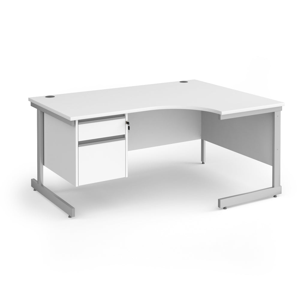 A white corner office desk with a two-drawer pedestal on the left and a silver metal frame, shown on a solid white background.