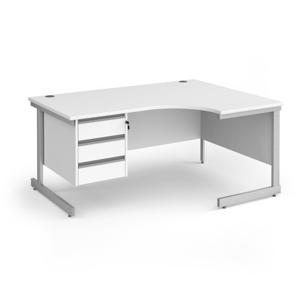A white corner office desk with a three-drawer pedestal on the left and a silver metal frame, shown on a solid white background.