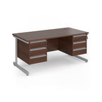 A modern office desk with a dark wood grain finish and silver metal legs, featuring three drawers on the left and three drawers on the right.