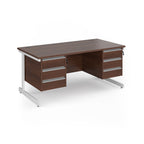 A modern office desk with a dark wood grain finish and white metal legs, featuring three drawers on the left and three drawers on the right.