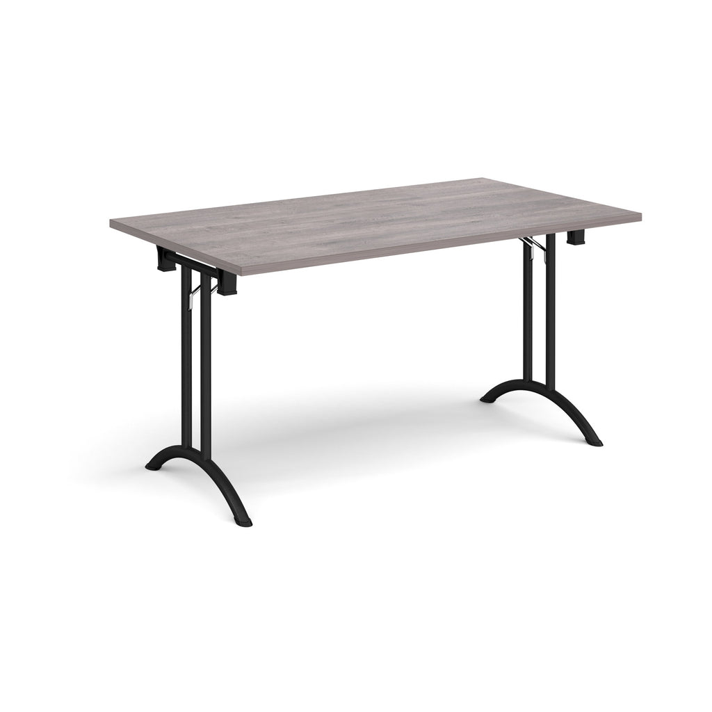 Folding table with grey wood-effect top and black legs on a white background