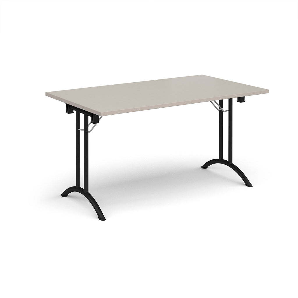 Folding table with light grey top and black legs on a white background