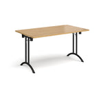 Folding table with wood-effect top and black legs on a white background