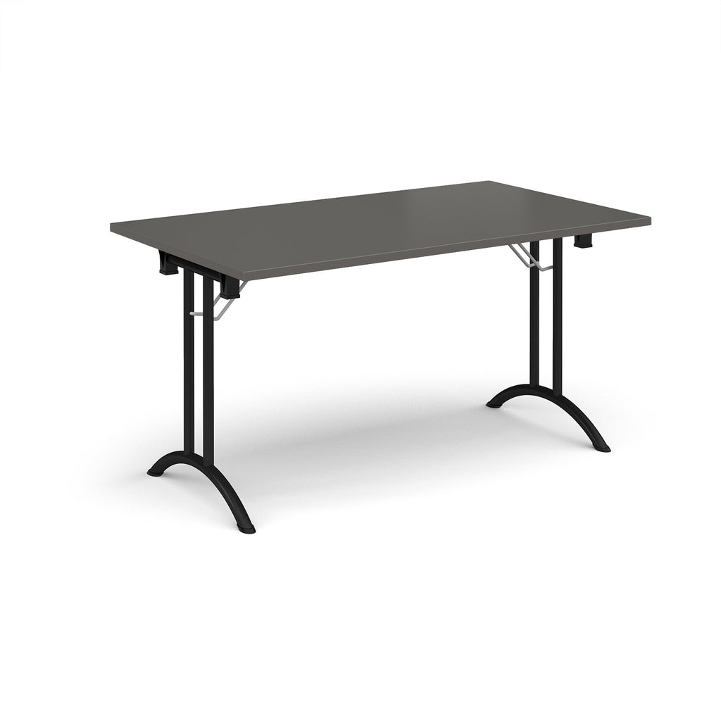 Folding table with grey top and black legs on a white background