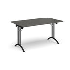 Folding table with grey top and black legs on a white background