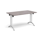 Folding table with grey wood-effect top and silver legs on a white background