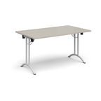 Folding table with light grey top and white legs on a white background