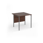 A square office desk with a wood-effect top and matching modesty panel, supported by slim grey metal legs, shown on a white background.