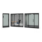 Three views of a modern acoustic booths with black frames, shown on a plain white background. One view shows the interior with a desk and chair, and one shows the closed exterior.