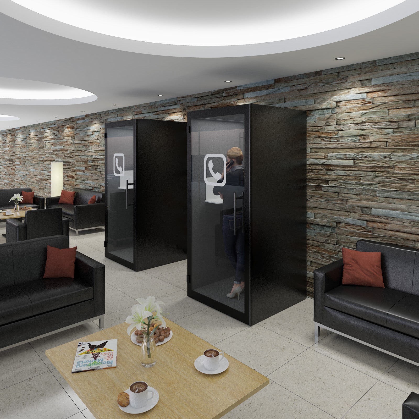 Modern waiting area with black privacy booths and comfortable seating.