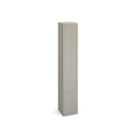 Tall grey locker with four doors on a white background