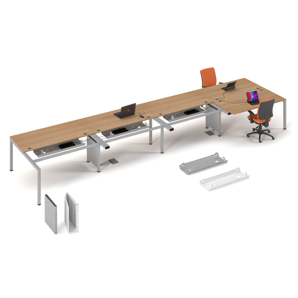 Long wooden office desk with multiple workstations on a white background