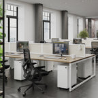 Modern office setup with desks, chairs, and computer monitors in a bright room.