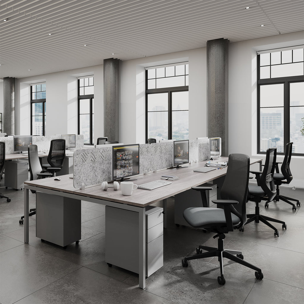 Modern office with desks, chairs, and large windows