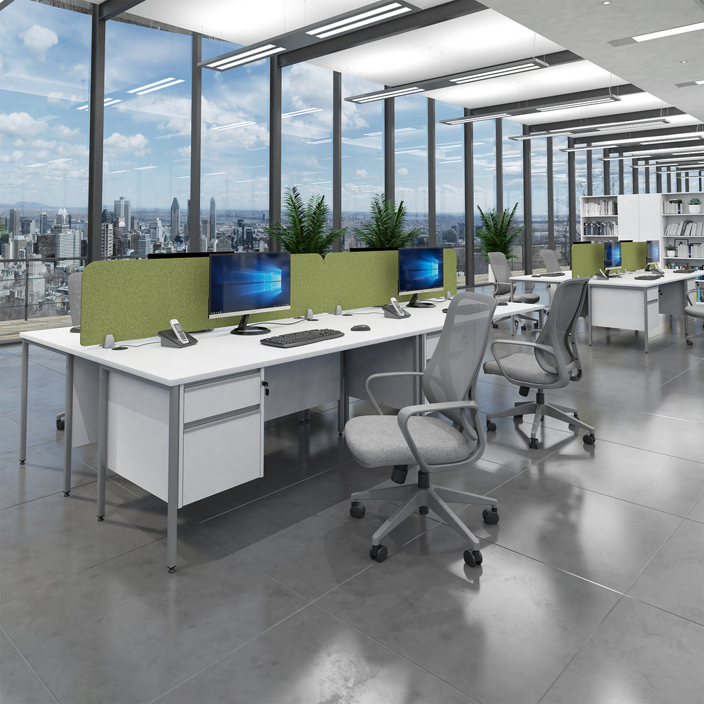 Modern office space with desks, chairs, and large windows overlooking a cityscape.