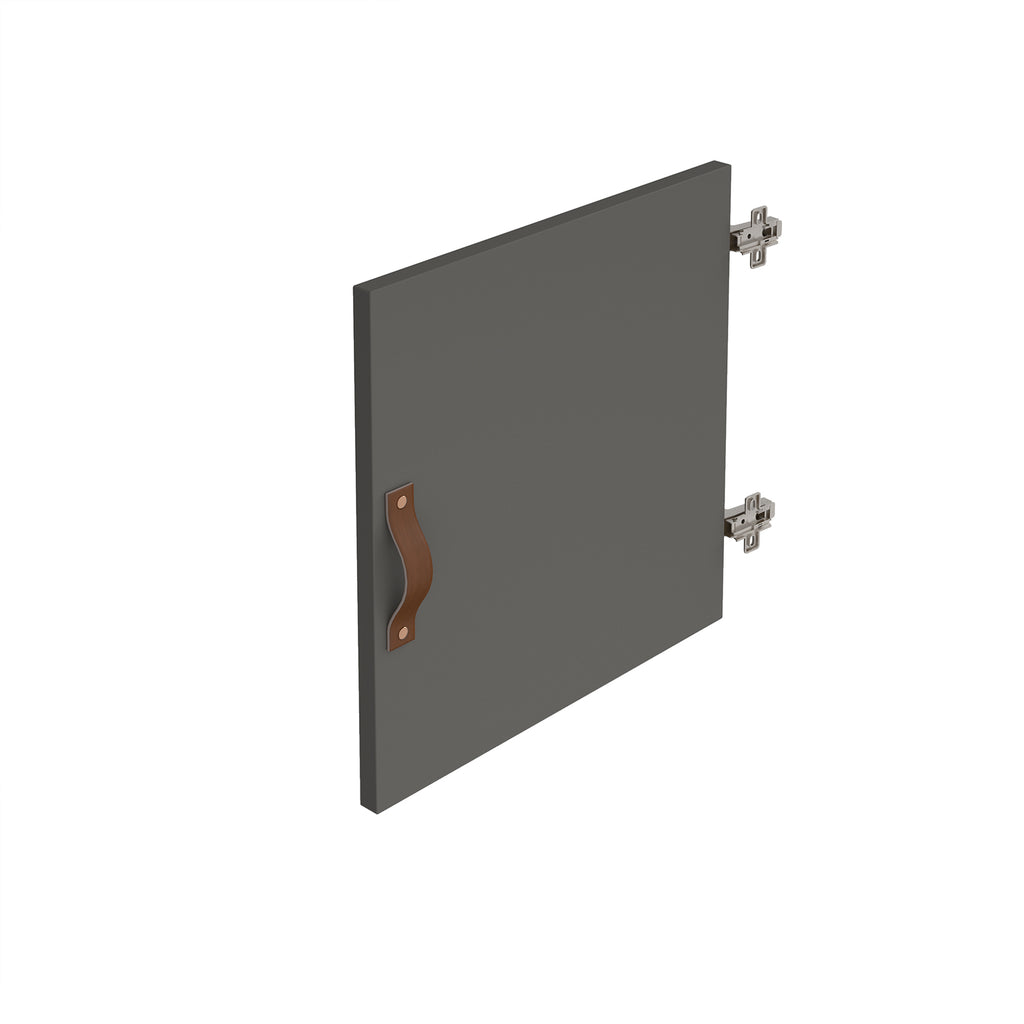 A dark grey cabinet door with a brown leather handle and silver metal hinges, shown at an angle on a plain white background.