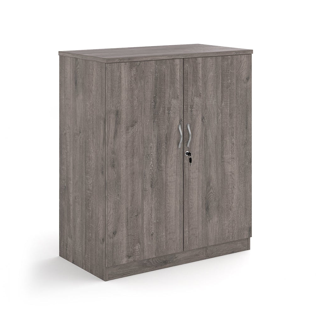 A two-door cabinet with a grey wood grain finish, featuring two vertical doors with slim silver handles and small lock keys, shown on a plain white background.
