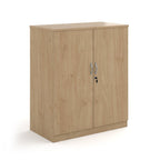 A two-door cabinet with a wood grain finish, featuring two vertical doors with slim silver handles and small lock keys, shown on a plain white background.