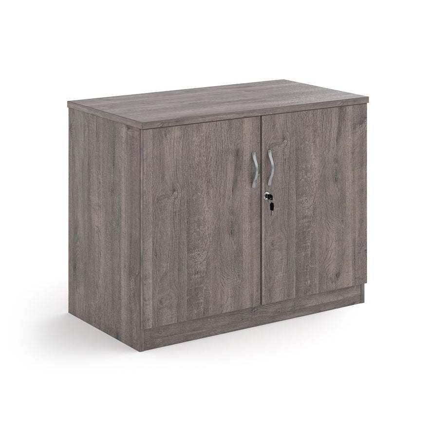 A two-door cabinet with a grey wood grain finish, featuring two vertical doors with slim silver handles and small lock keys, shown on a plain white background.