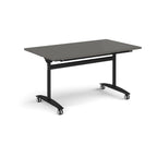 Rectangular table with a grey top and black metal legs with castors on a white background