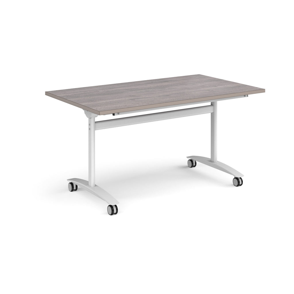Rectangular table with a grey wood-effect top and white metal legs with castors on a white background