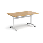 Rectangular table with a wood-effect top and white metal legs with castors on a white background
