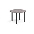 Round table with grey top and black legs on a white background