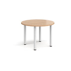 Round wooden table with white legs on a white background