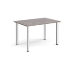 Rectangular table with a grey surface and metal legs on a white background