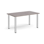 Rectangular table with a grey wood-effect top and metal legs on a white background