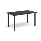 Rectangular table with a black top and metal legs on a white background