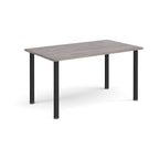 Rectangular table with a grey wood-effect top and black legs on a white background