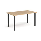 Rectangular table with a wood-effect top and black legs on a white background