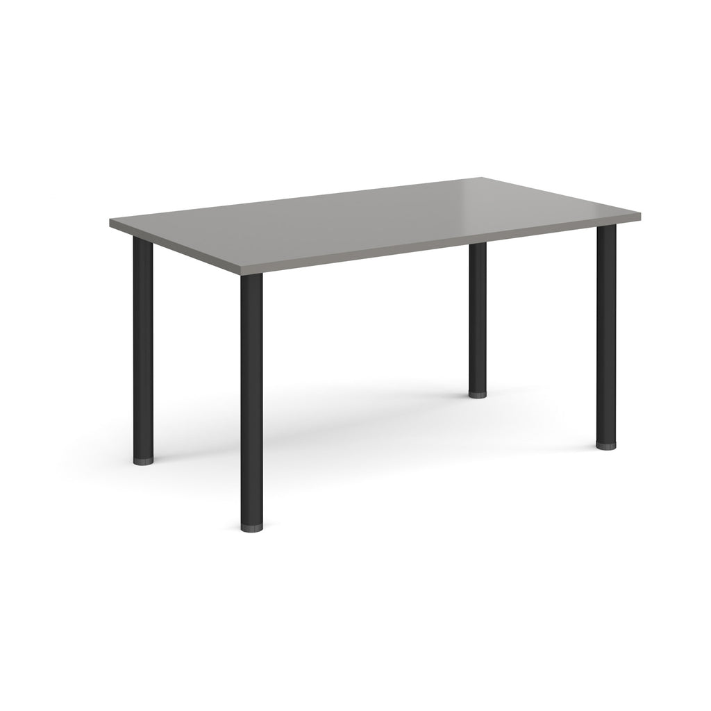 Rectangular table with grey top and black legs on a white background