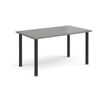 Rectangular table with grey top and black legs on a white background