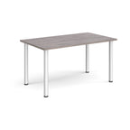 Rectangular table with a grey wood-effect top and silver legs on a white background