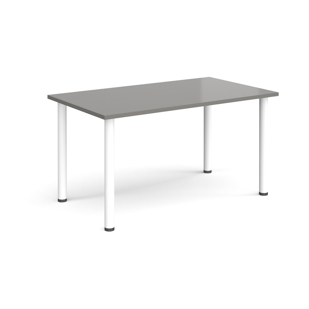 Rectangular desk with grey top and white legs on a white background