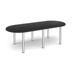 Oval table with black top and chrome metal legs on a white background