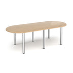 Oval table with wood-effect top and chrome metal legs on a white background