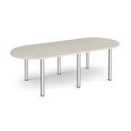 Oval table with light grey top and chrome metal legs on a white background