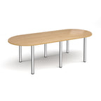 Oval table with wood-effect top and chrome metal legs on a white background
