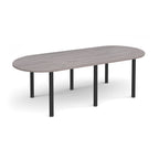 Oval table with grey wood-effect top and black metal legs on a white background