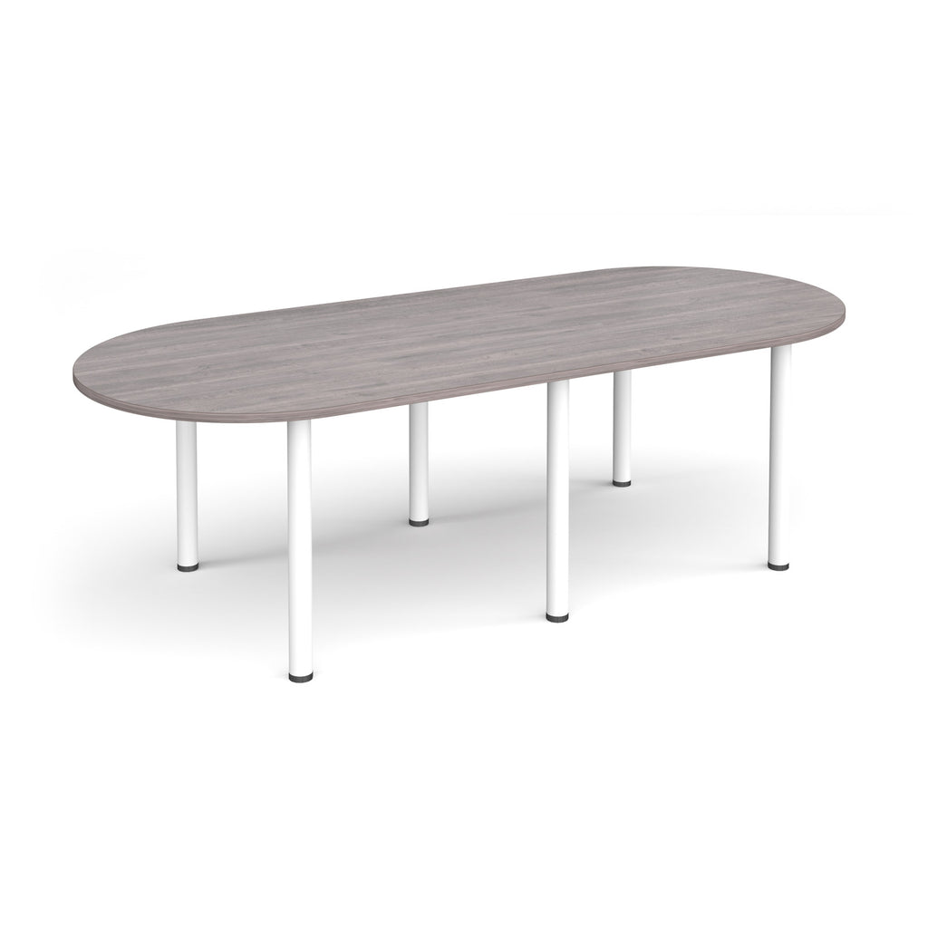 Oval table with grey wood-effect top and white metal legs on a white background